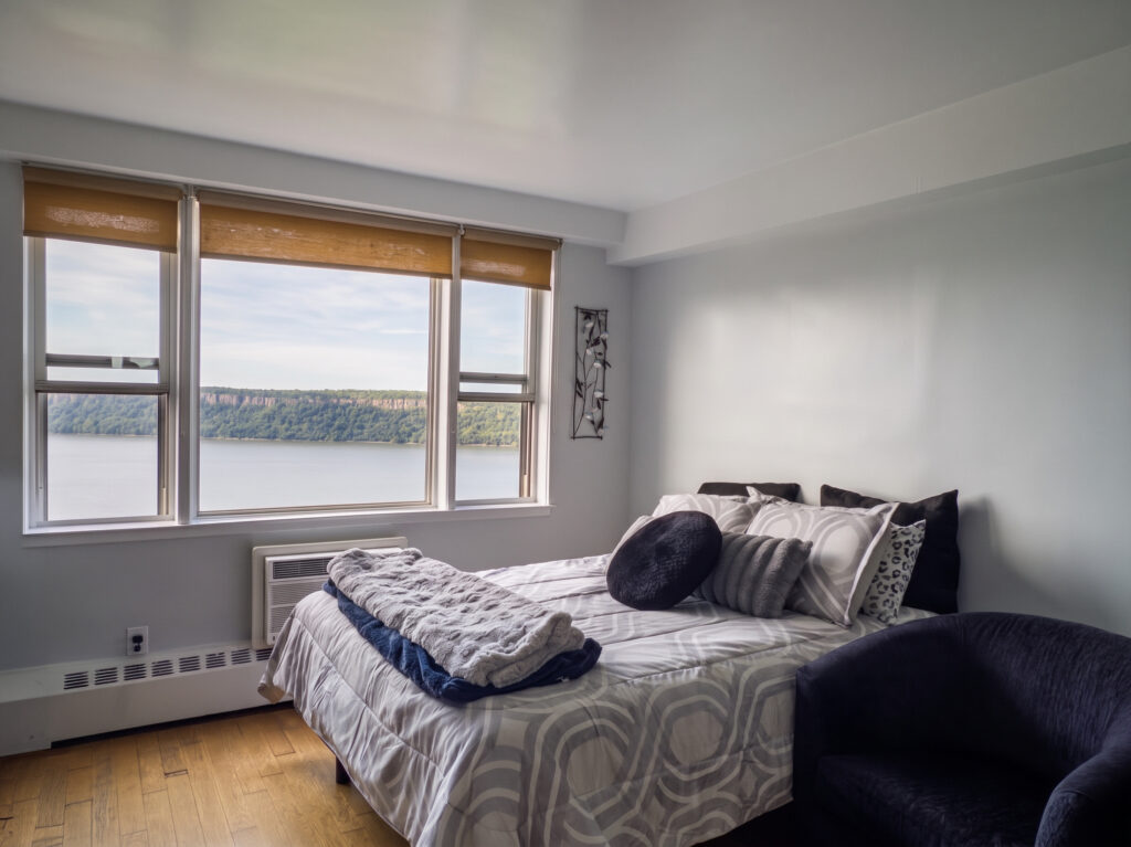 Discover sweeping Hudson River views and elevated high-rise living at 5900 Arlington Avenue, Unit 22N. Featuring a light-filled open layout, a functional kitchen with a breakfast bar, and a walk-in closet that doubles as a home office, this top-floor studio blends everyday comfort with versatile design. Enjoy full-service co-op living with resort-style amenities, including an Olympic pool, high-end gym, and a private Metro-North shuttle just minutes from North Riverdale's best dining and shopping.